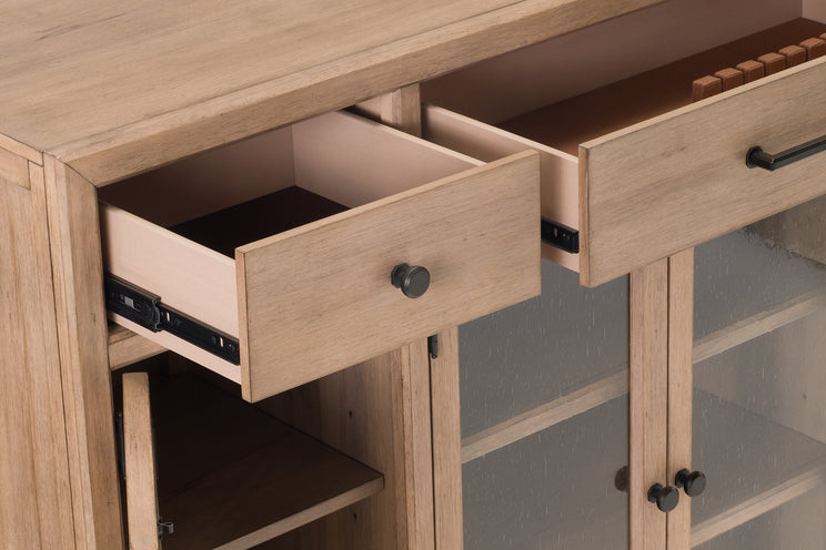 Wooden sideboard with open drawers and glass panels